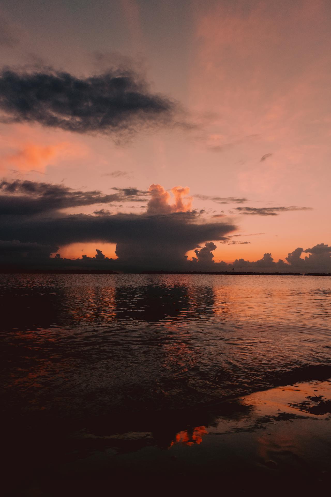 a sunset over a body of water