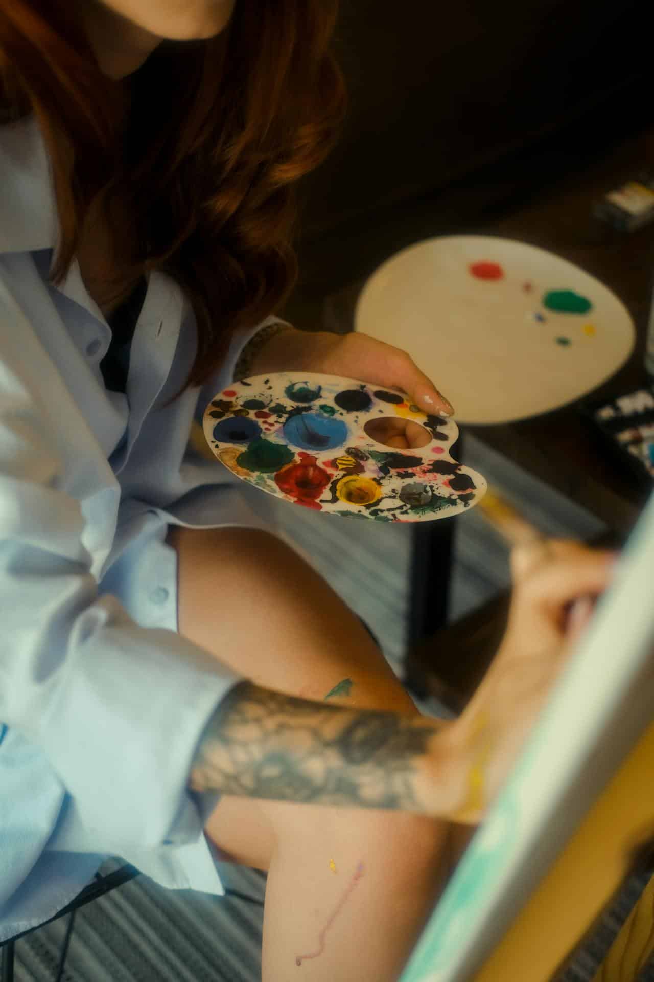 a person holding a paint palette
